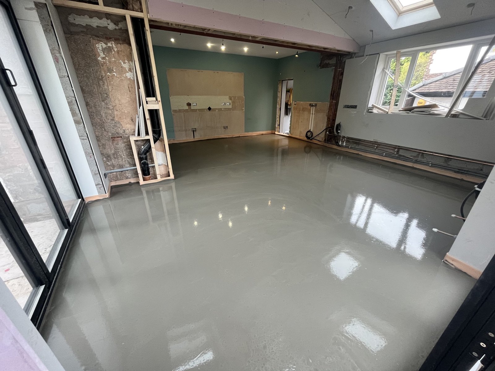 The extension with its new floor screed freshly poured