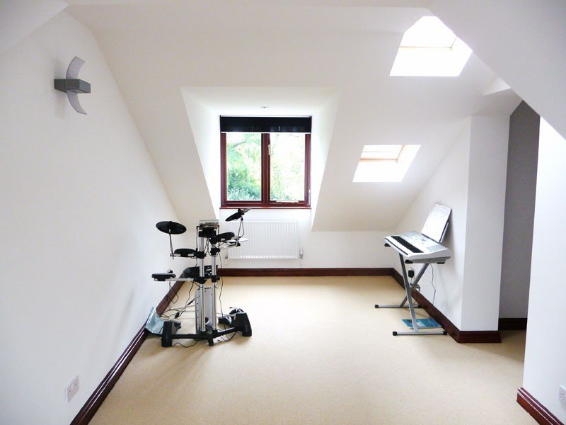A bright loft conversion with a dormer window and rooflights